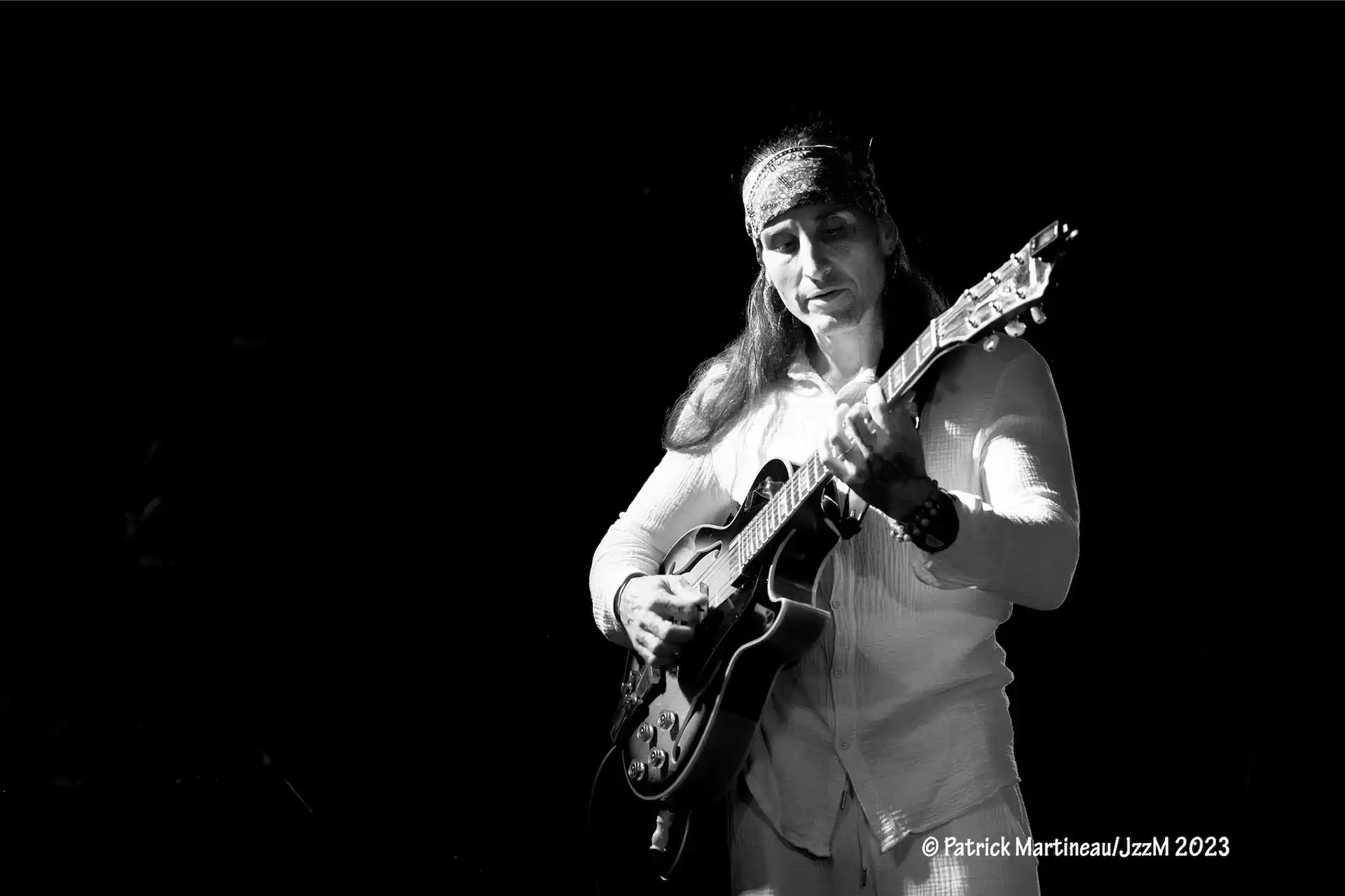 People watching a concert. Photo with a purple hue